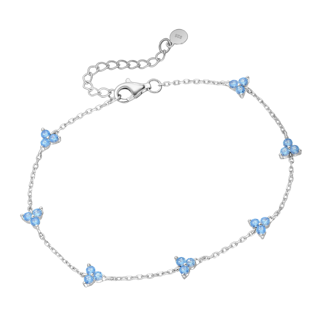 sterling silver light blue CZ trio flower station bracelet on an adjustable rhodium-plated chain with lobster clasp