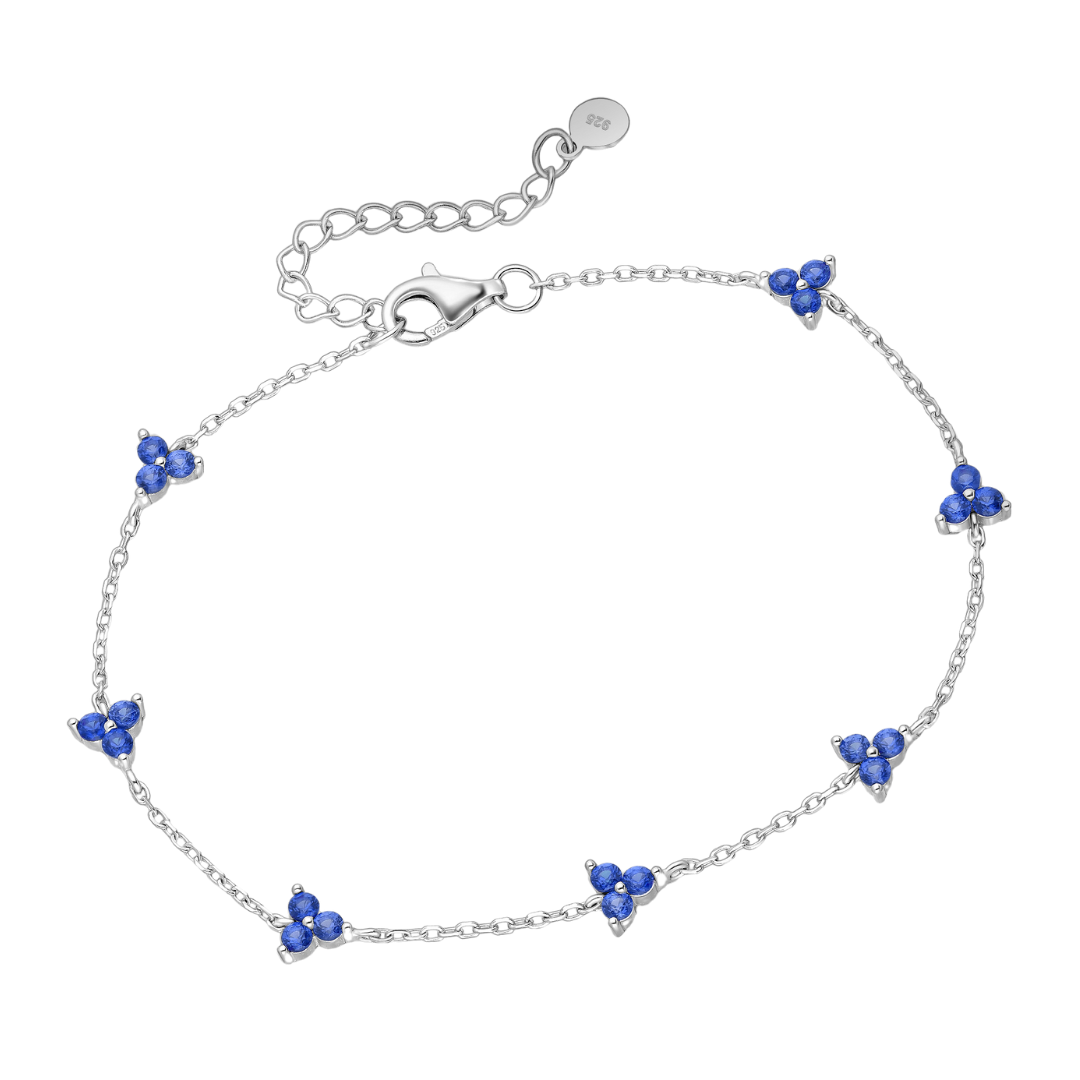 sterling silver blue CZ flower station bracelet on an adjustable rhodium-plated chain with lobster clasp