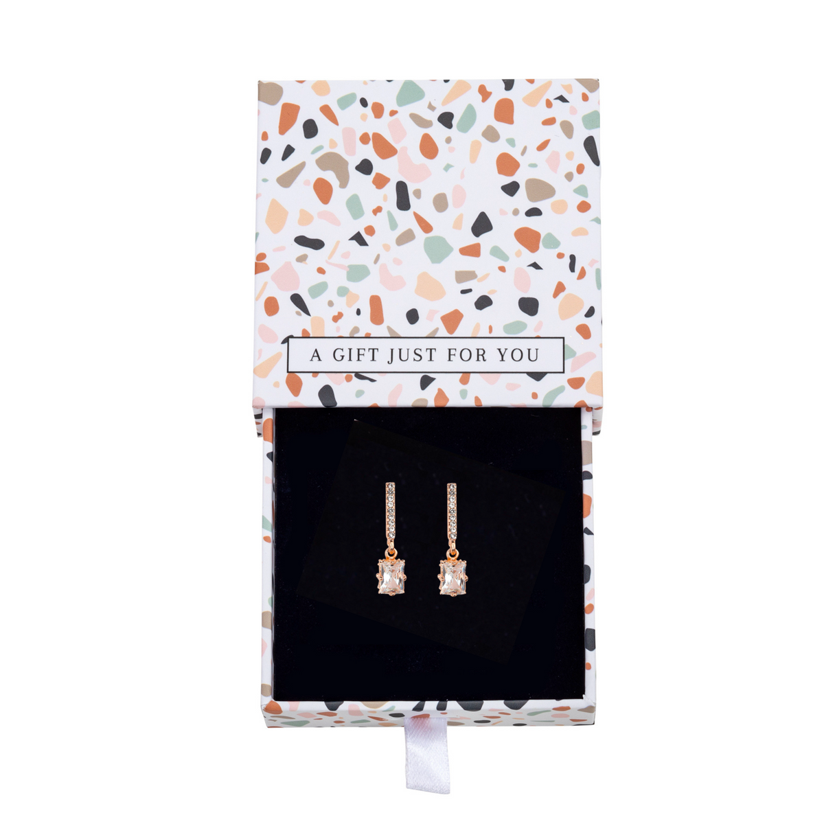 Bar and baguette crystal earrings inside an open patterned gift box