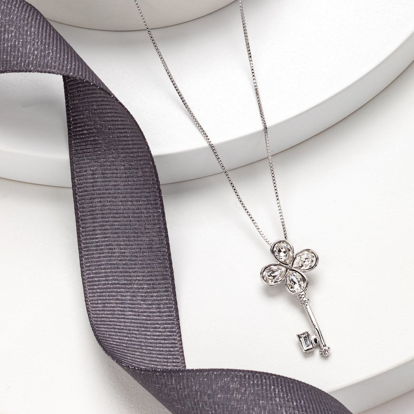 Statement key necklace with Swarovski crystals, rhodium plated, adjustable 18 to 20 inch chain, sparkling clover design by callura