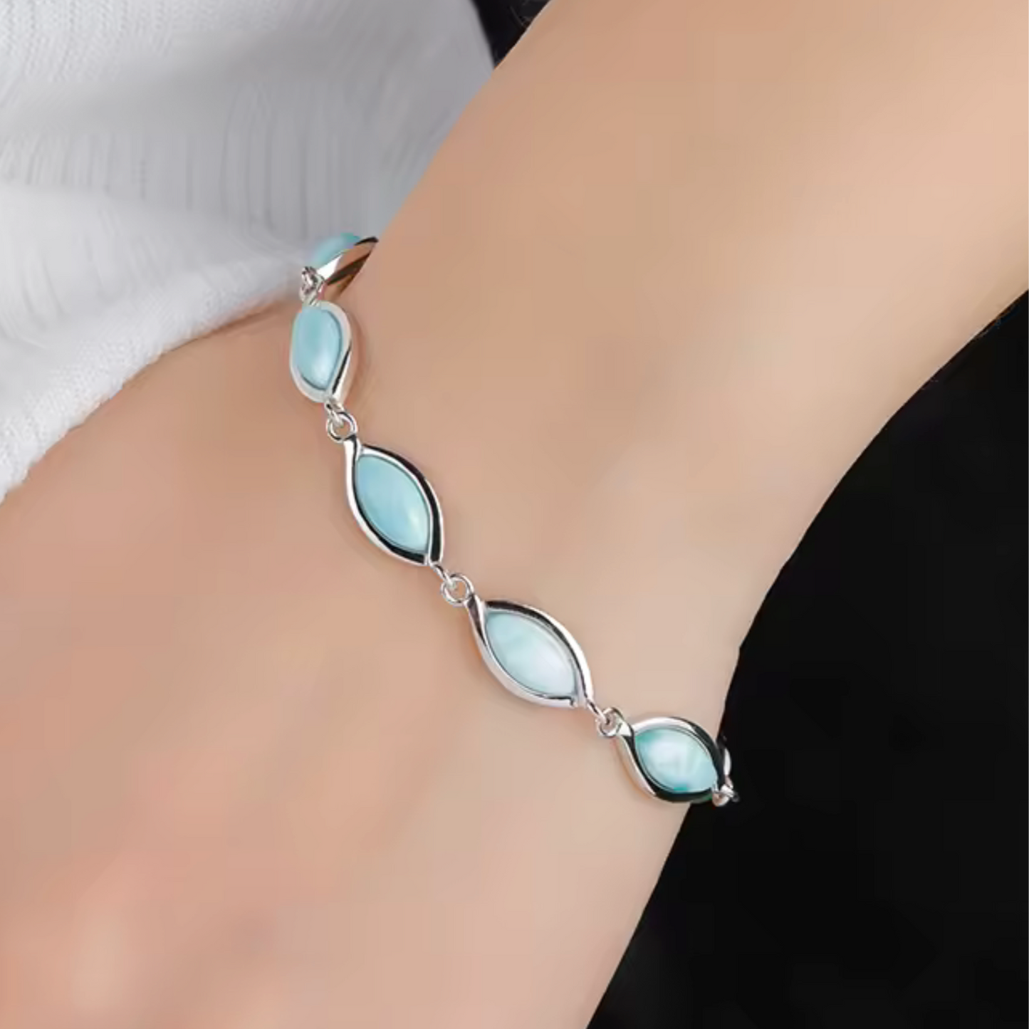 sterling silver bracelet with genuine marquise-cut larimar stones and lobster clasp, sea-blue gemstone jewellery on model