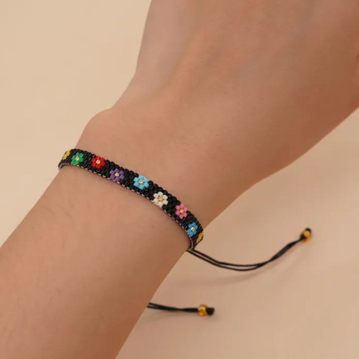 Black Seed Bead And Rainbow Daisy Adjustable Bracelet