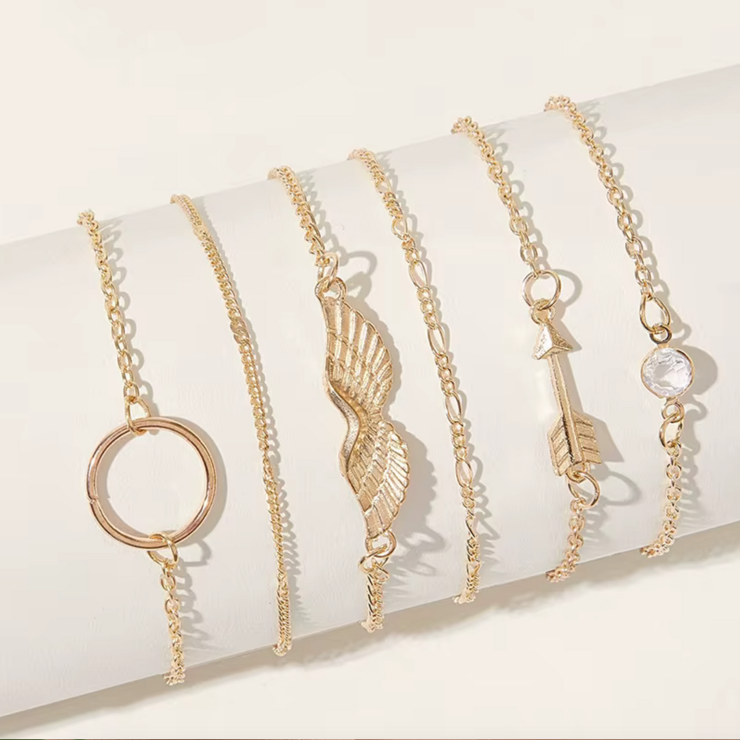 Goldtone Bracelet Set With Wing Circle