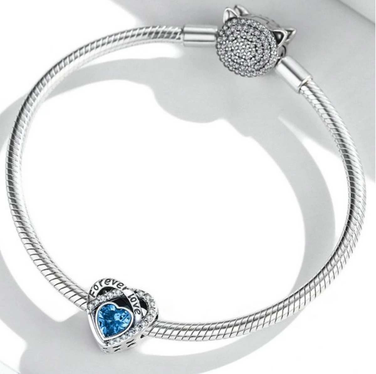 Sterling Silver “Forever Love” Charm with Blue Heart Crystal