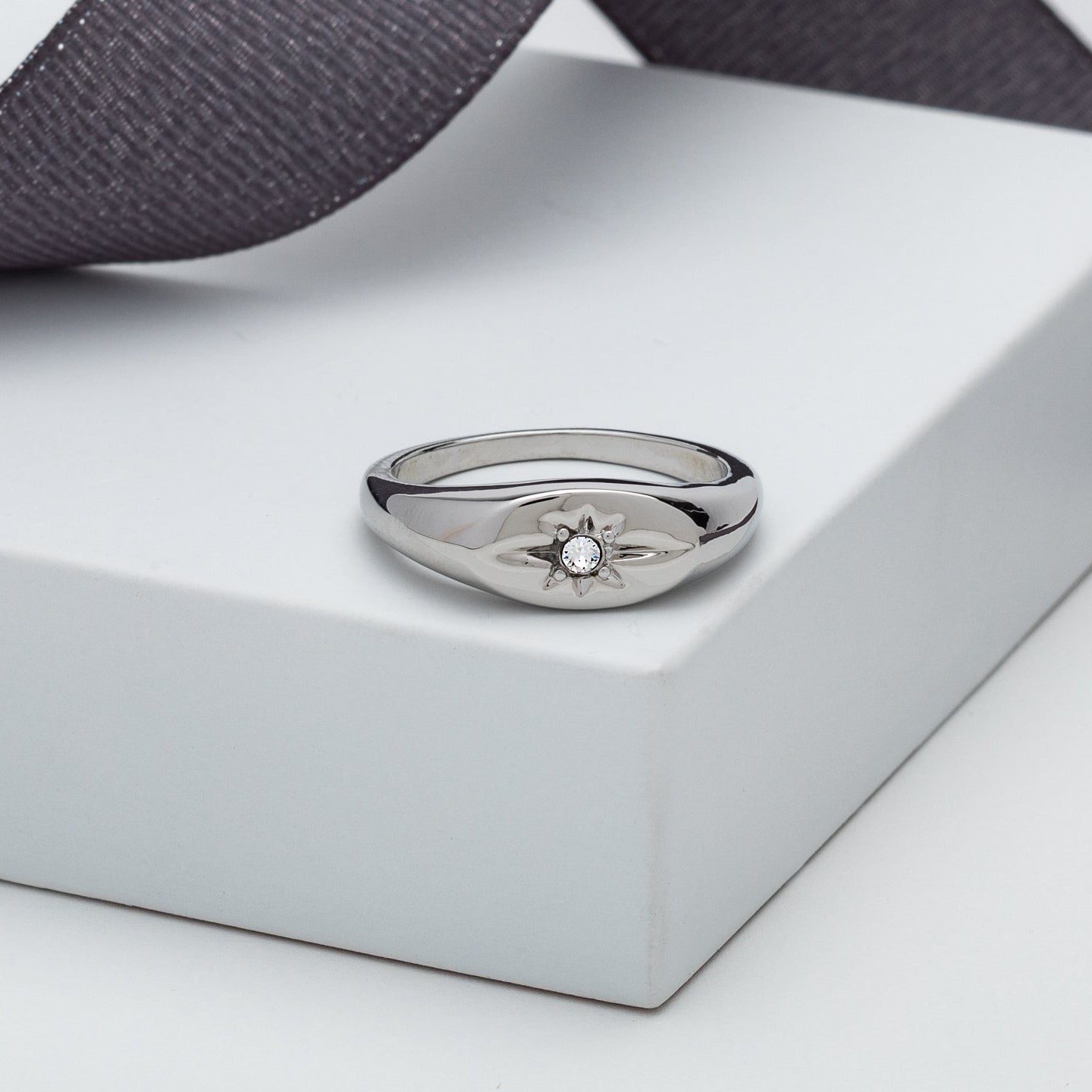 Rhodium-plated North Star signet ring with Swarovski crystal – front view on display