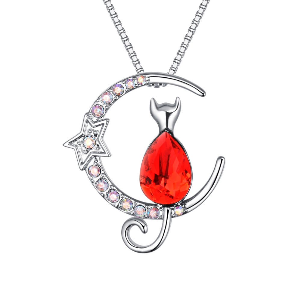 Rhodium-plated cat and moon necklace with teardrop Swarovski crystal body and sparkling star accent.