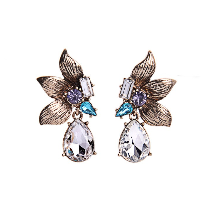 A pair of vintage floral crystal teardrop earrings with a metallic and patina finish.