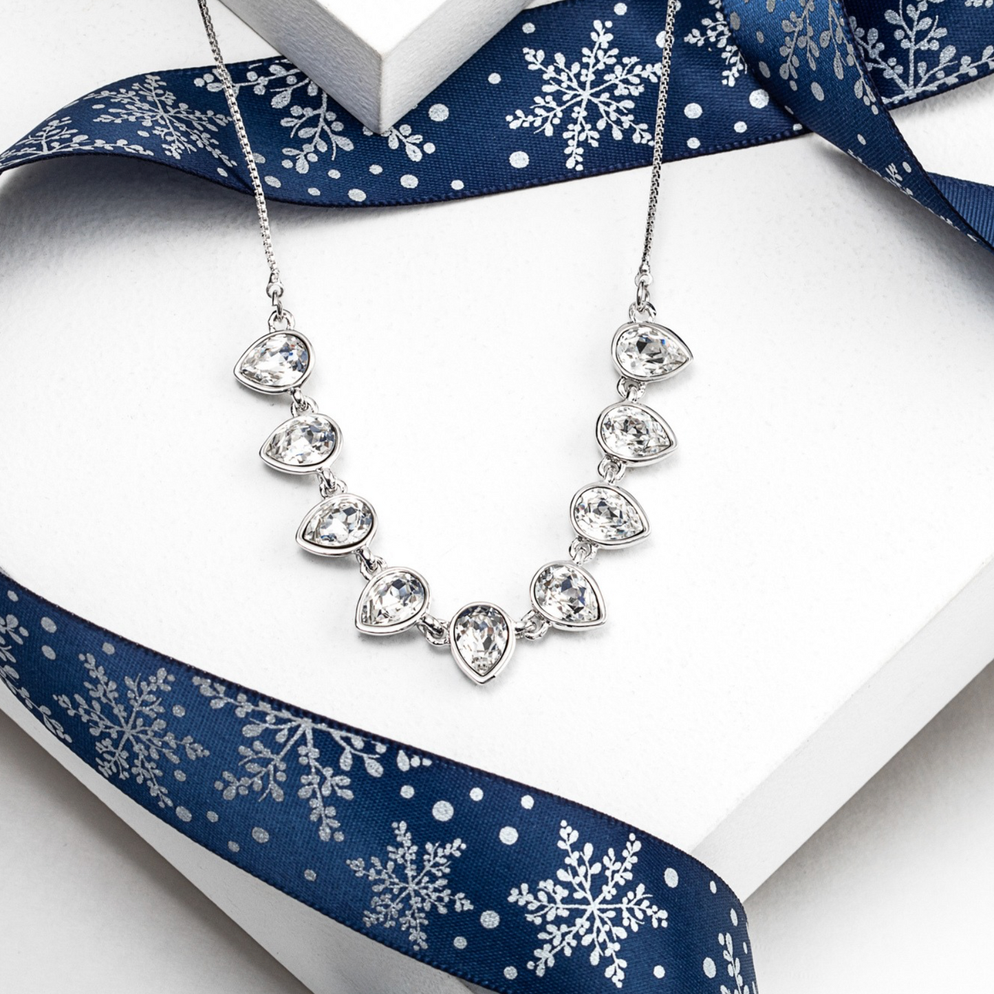 Rhodium-plated necklace featuring brilliant teardrop crystals made with Swarovski
