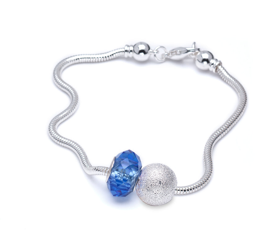 Silver Plated Charm Bracelet With Blue Faceted Crystal Charm