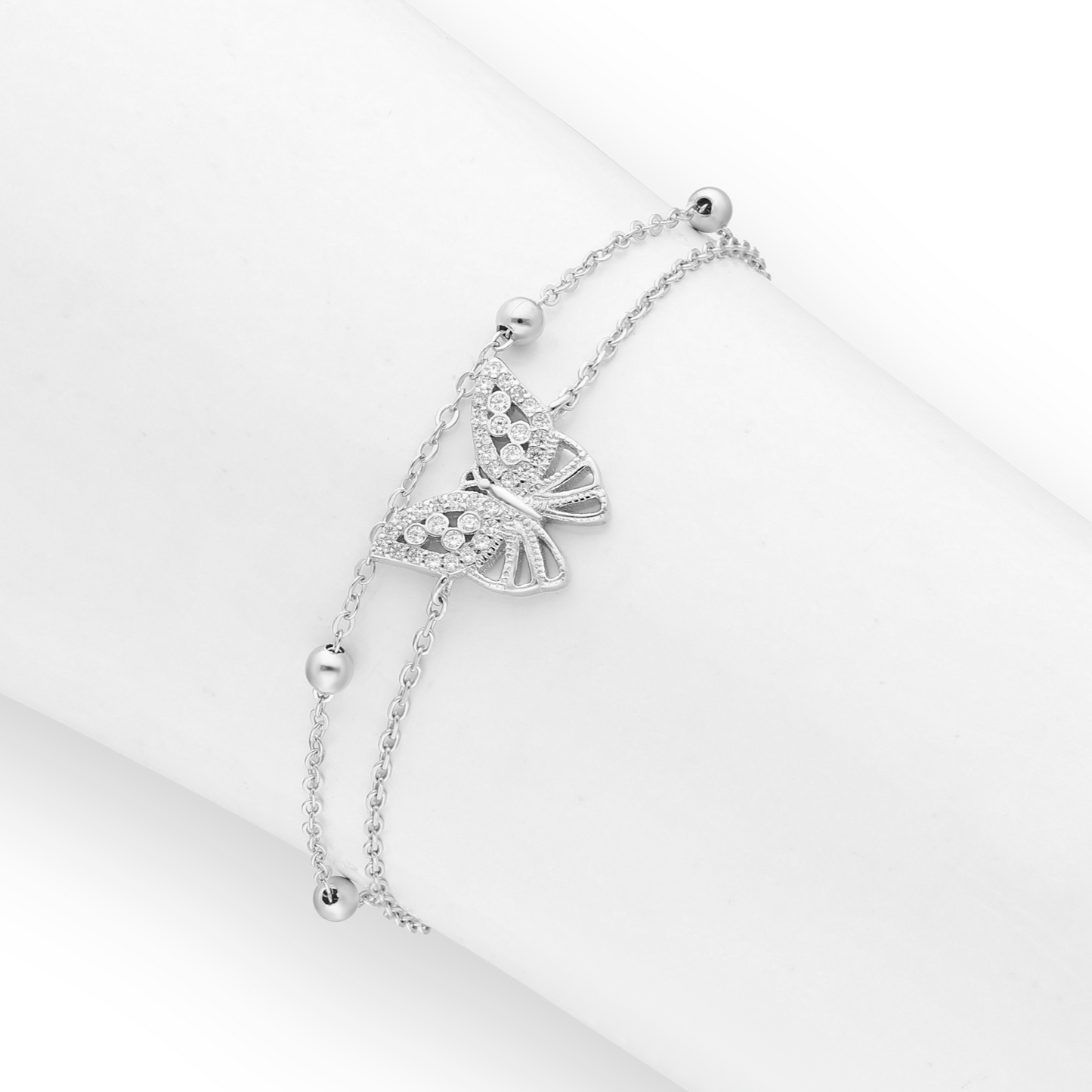 Rhodium-plated sterling silver double-chain bracelet with pavé CZ butterfly and polished bead stations, adjustable women’s jewellery.
