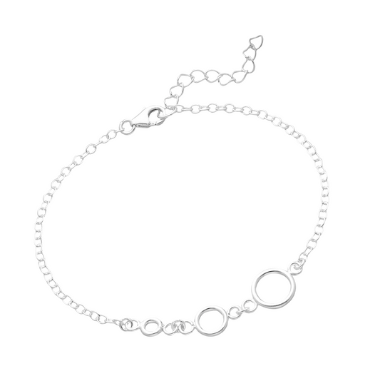 Sterling silver open circle station bracelet on an adjustable cable chain, polished minimalist women’s jewellery.