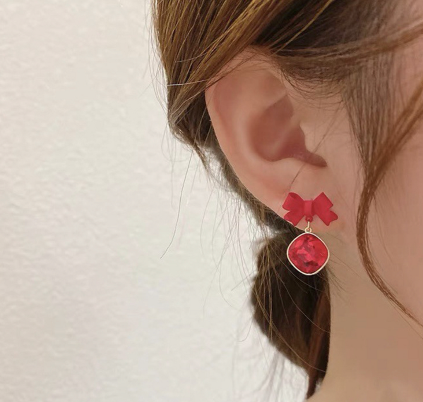 Red Crystal Bow Drop Earrings In Gold