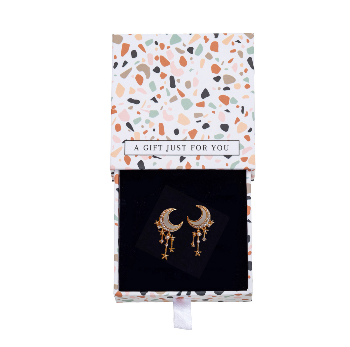 Goldtone moon and star earrings in an open floral gift box