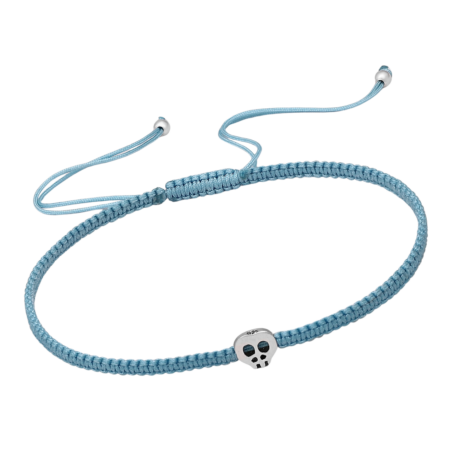 Blue macramé cord bracelet with a small sterling silver skull bead and adjustable slider, minimalist unisex jewellery.