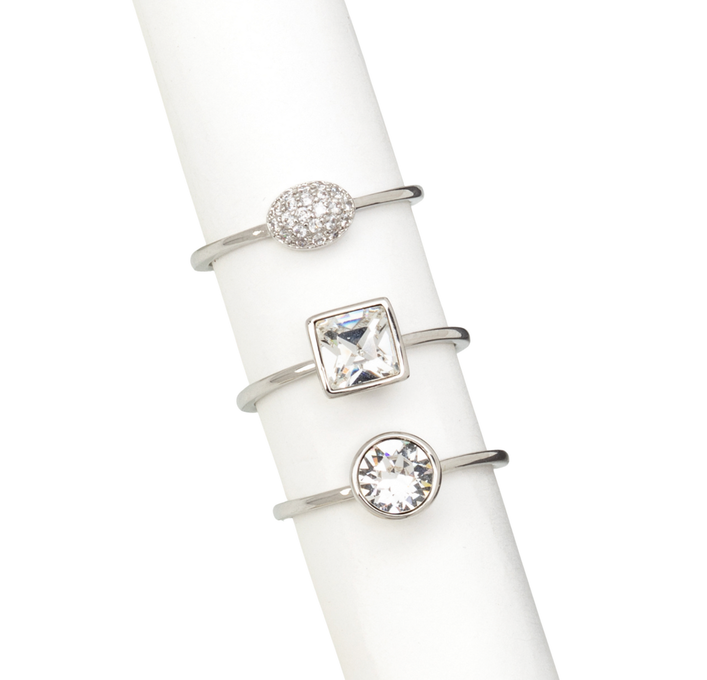 Rhodium-plated stackable ring set with clear CZ and Swarovski crystals – trio design displayed on white stand