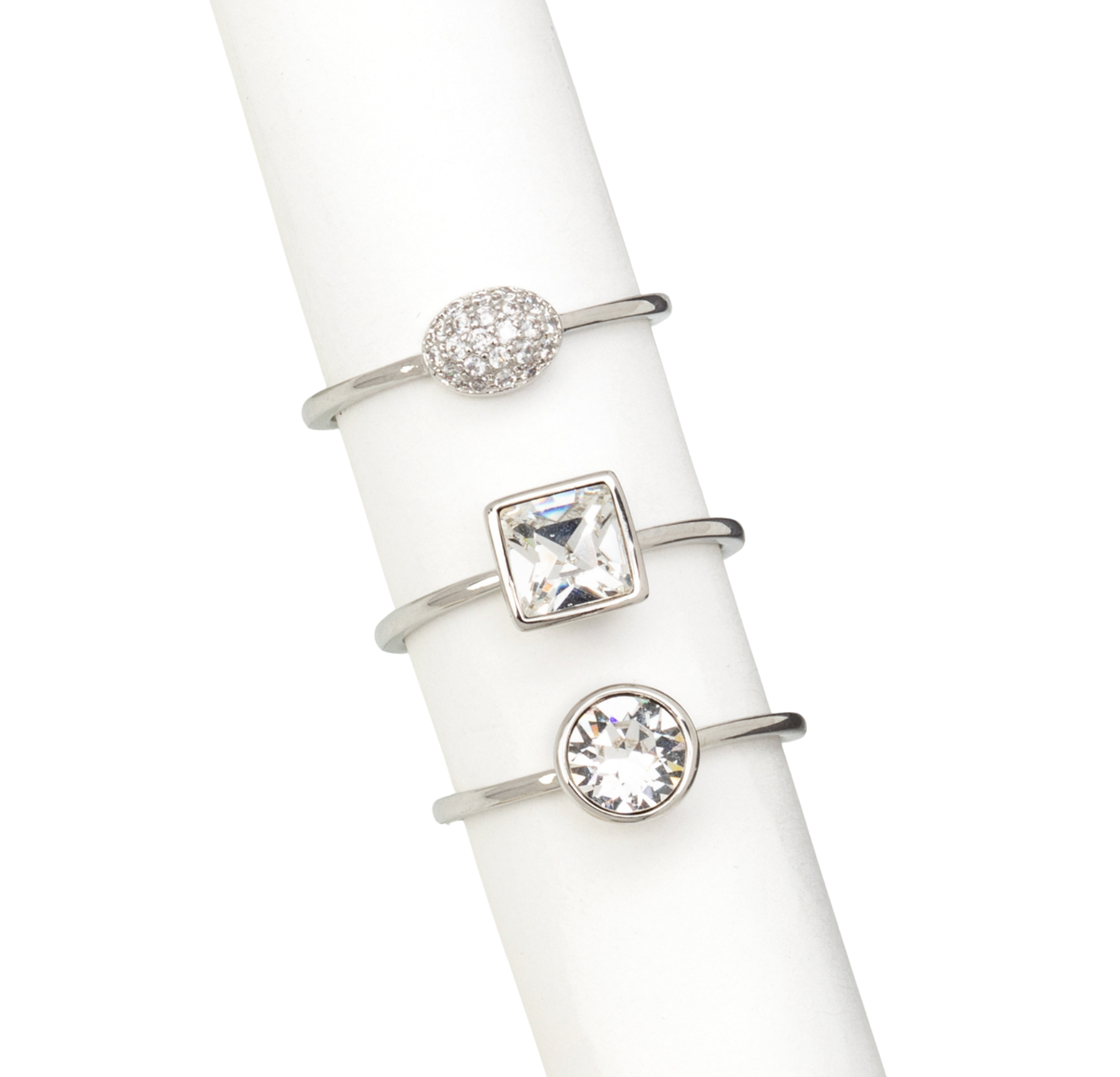Rhodium-plated stackable ring set with clear CZ and Swarovski crystals – trio design displayed on white stand