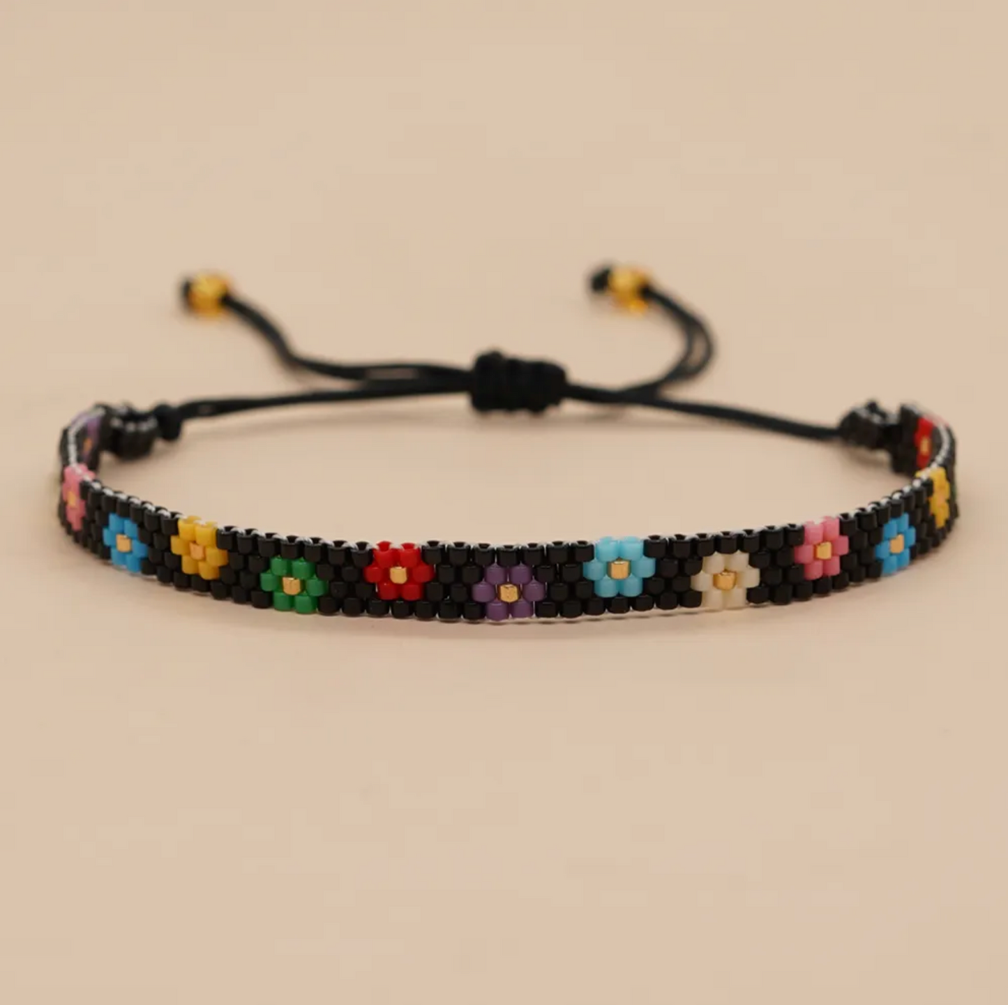 Black Seed Bead And Rainbow Daisy Adjustable Bracelet