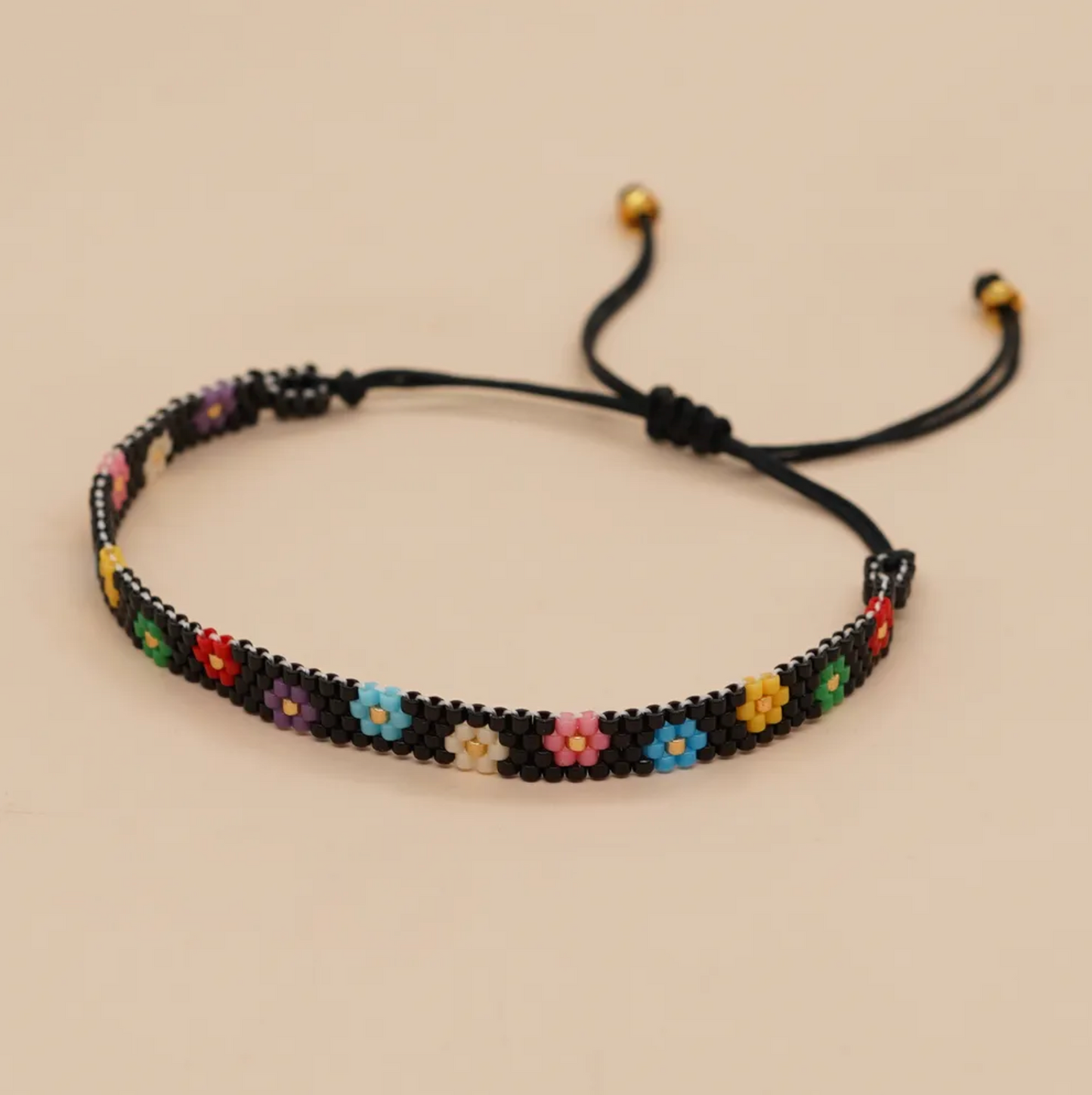 Black Seed Bead And Rainbow Daisy Adjustable Bracelet