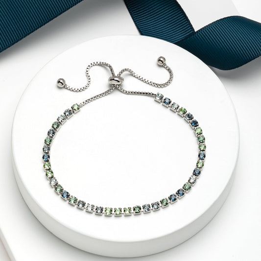 Adjustable tennis bracelet with Swarovski crystals, green and blue gradient, rhodium plated sliding closure design by callura