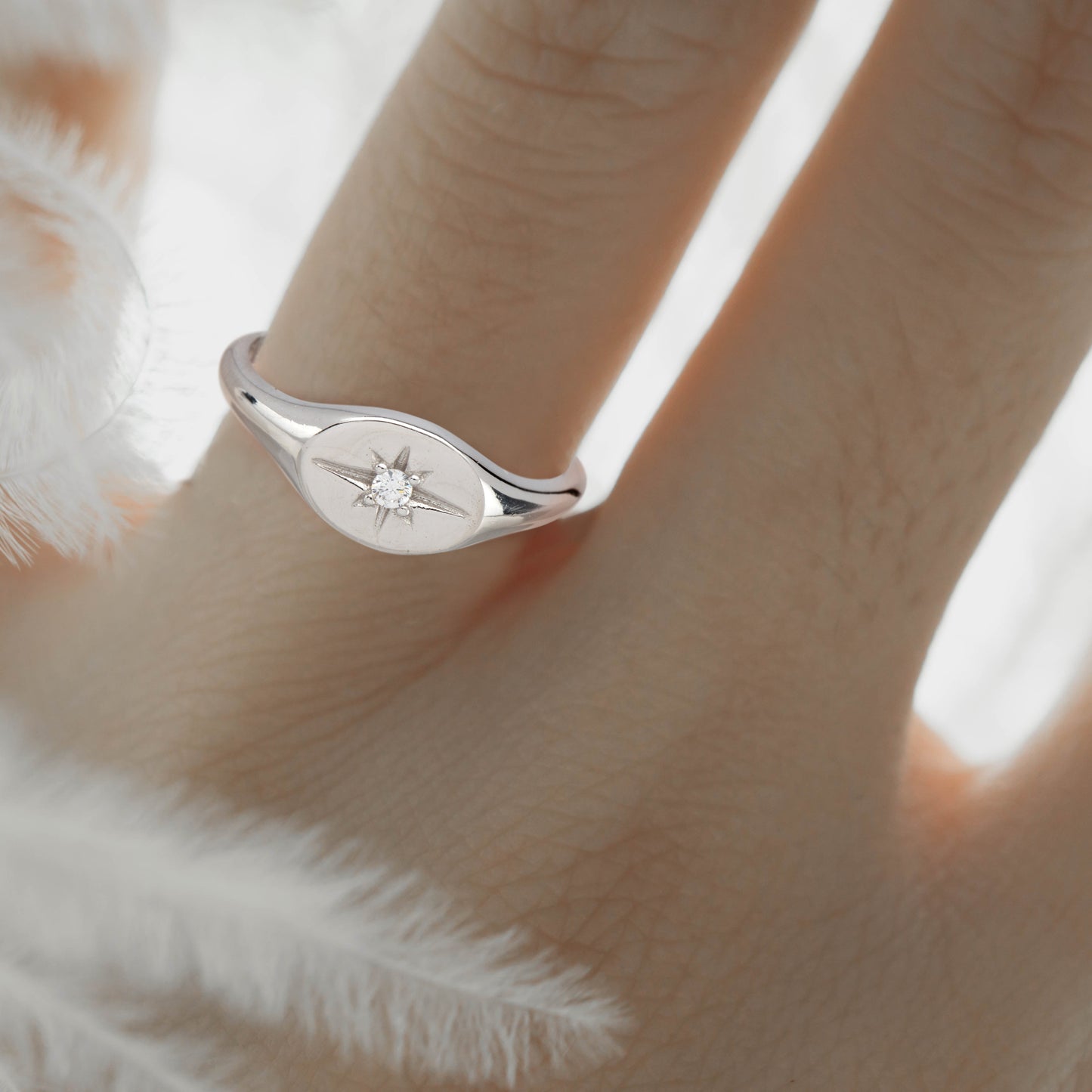 Rhodium-plated North Star signet ring with Swarovski crystal on model