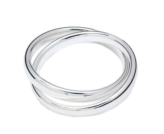 Sterling silver filled rolling ring with three interlocking bands. Classic polished design for elegant daily wear or special occasions.