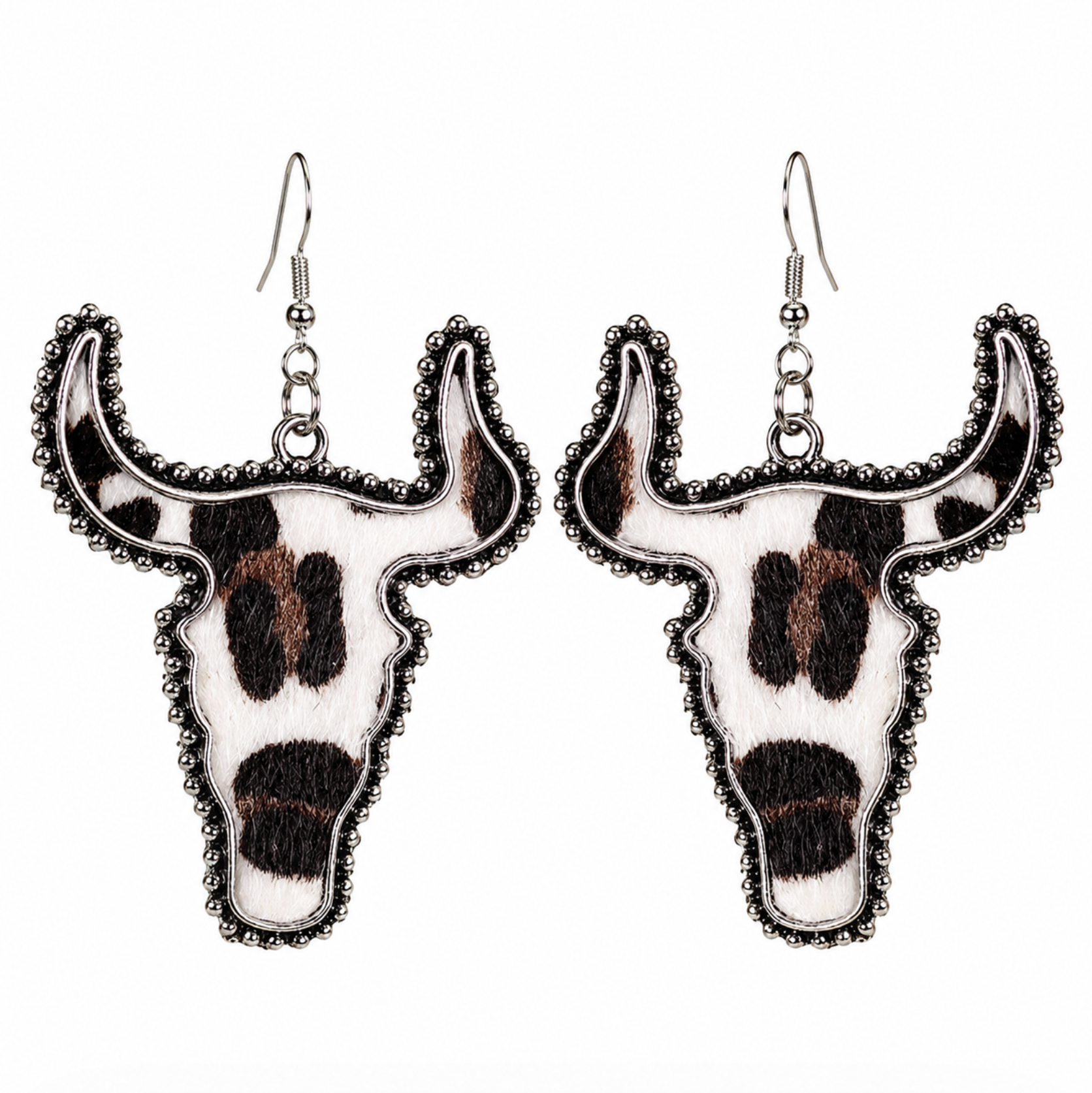 Silvertone longhorn skull drop earrings with a black and white cow print