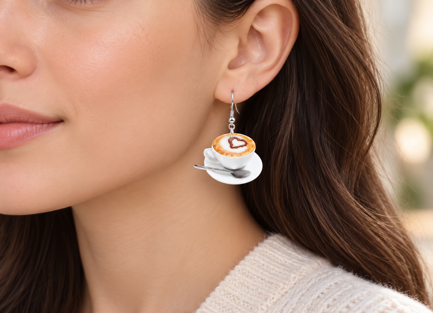 Coffee cup drop earring worn on model, true-to-life scale