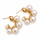 Goldtone & Imitation Pearl Graduated Hoop Earrings on a white background