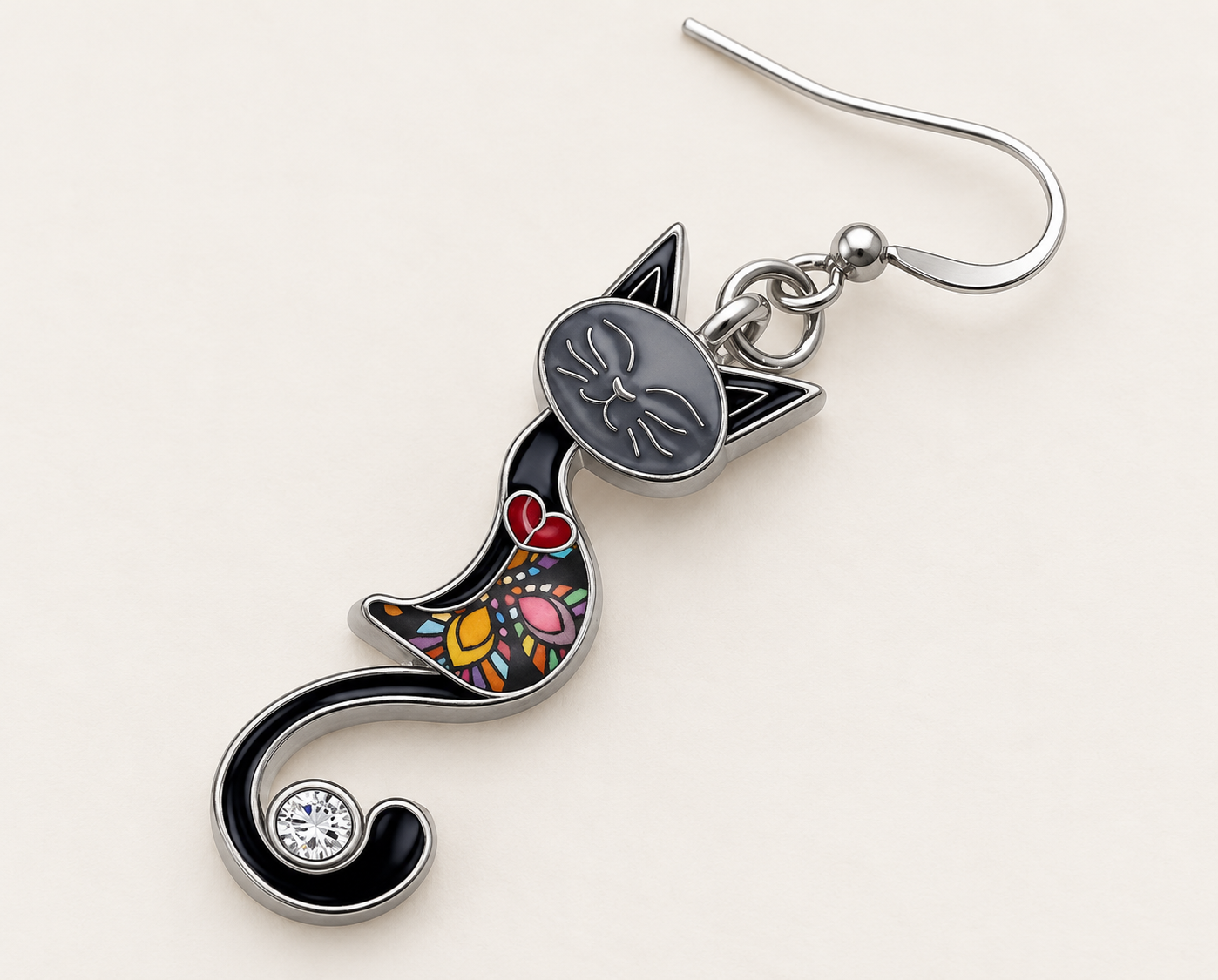 Black enamel mosaic cat earring detail with curled tail and rhinestone