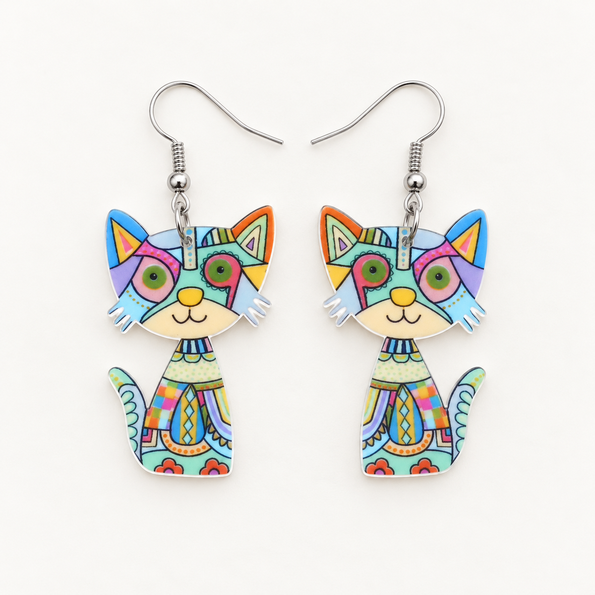 Blue multicolour patchwork acrylic cat earrings, mirrored left and right pair