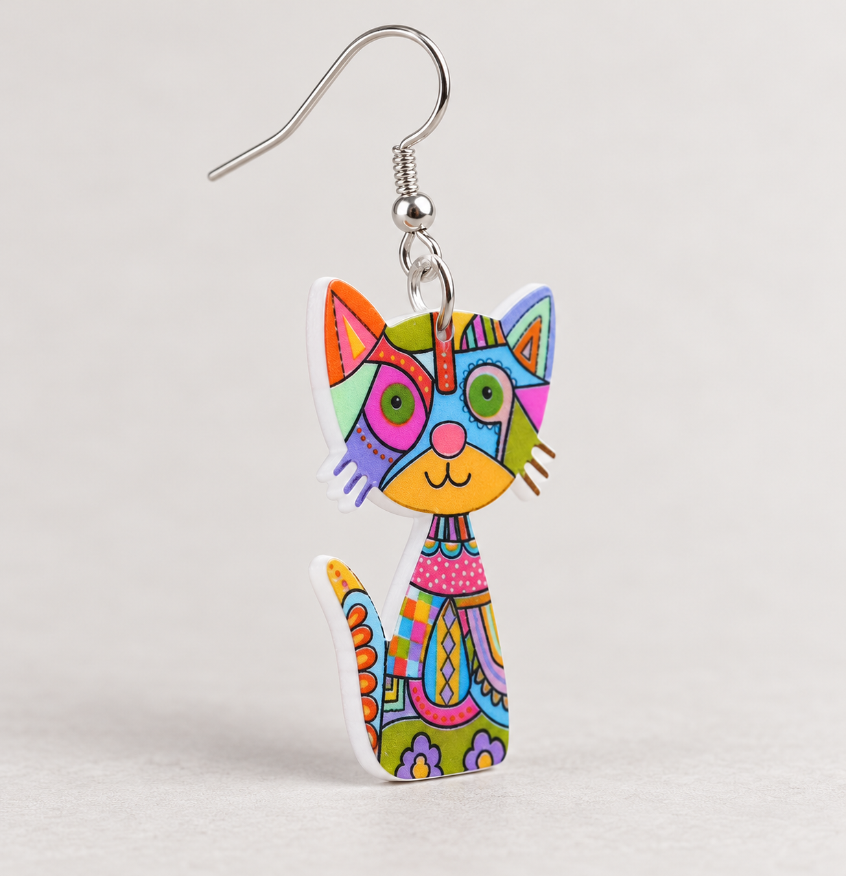 Multicolour cat earring detail showing printed acrylic charm