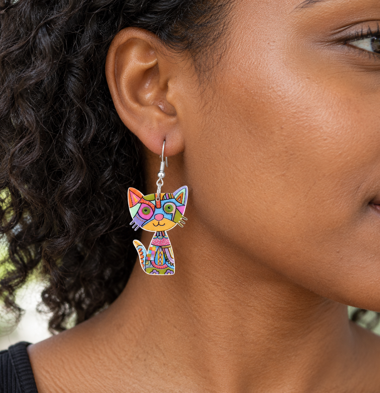Multicolour patchwork acrylic cat earring worn on a model