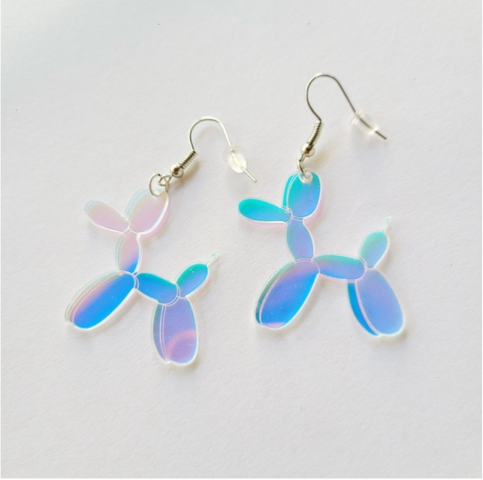 Iridescent blue and purple balloon dog earrings with hook fastenings