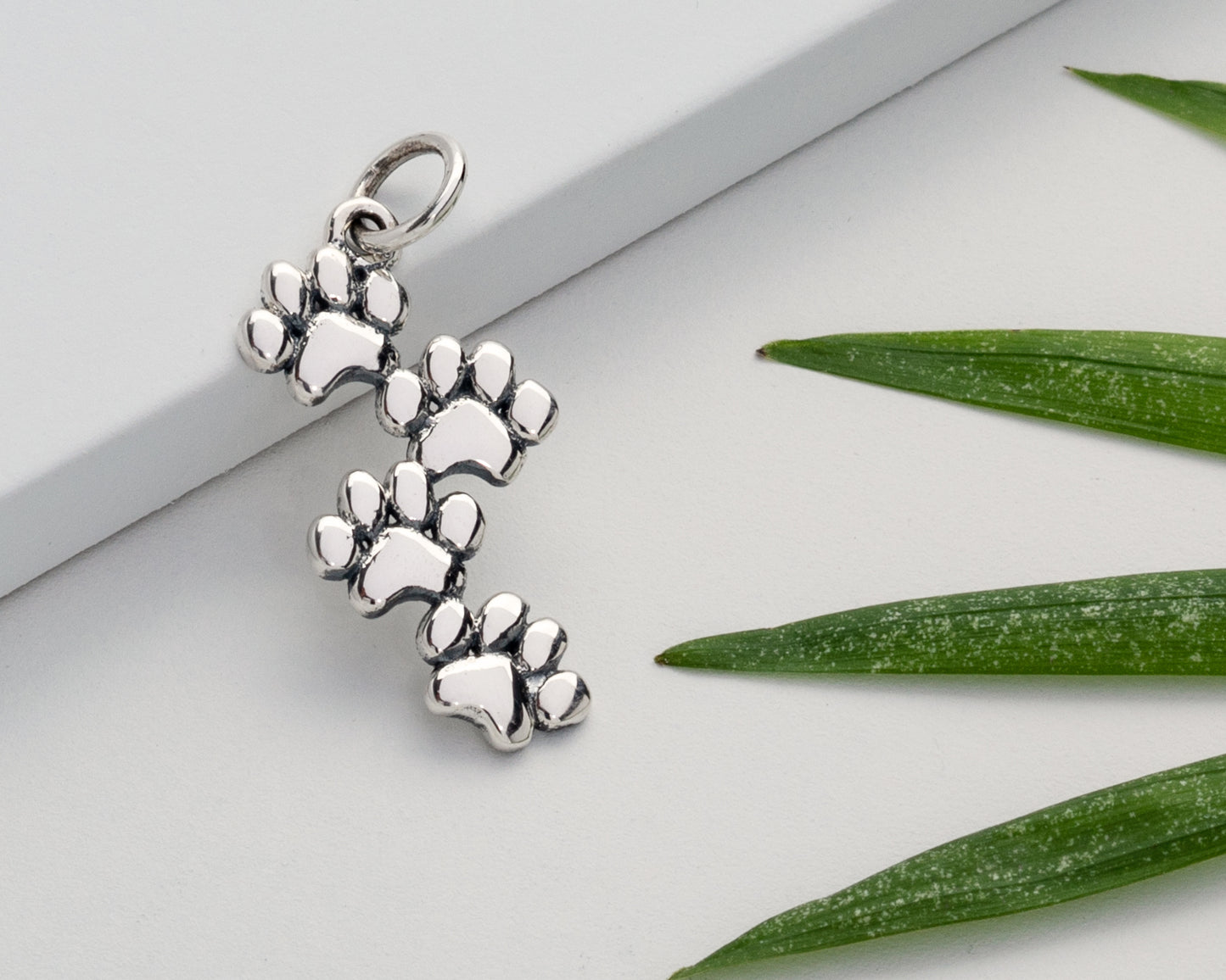 Sterling Silver Paw Prints Pendant