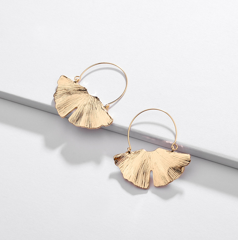 Goldtone drop earrings with textured fan-shaped lotus details